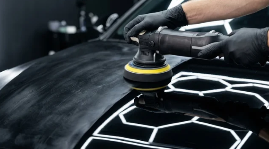 Freshly painted bonnet being machine polished