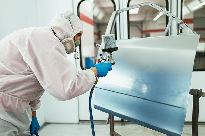 Panel being refinished in the spray booth